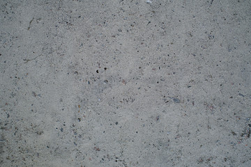 Detail of a gray wall close up. Cinderblock garage, detailing the outside of the garage wall