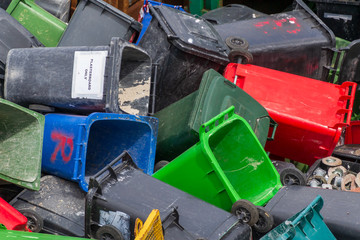 Colorful trash cans. Many plastic garbage cans on the waste waiting to be recycled. Produced from plastic that can be reused, recovery or disposal.