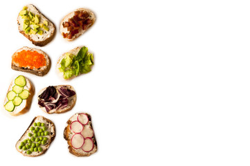 sandwiches or tapas prepared with bread and tasty ingredients. Could be nice food for healthy breakfast ot lunch. Copy space for your text on right