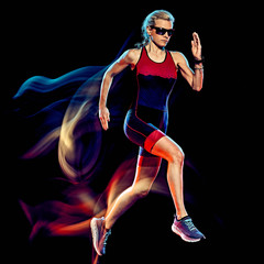 one caucasian woman triathlon triathlete runner running joogger jogging studio shot isolated on black background with light painting effect - obrazy, fototapety, plakaty