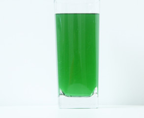 Glass of green liquid on white background, São Paulo, Brazil