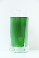 Glass of green liquid on white background, São Paulo, Brazil