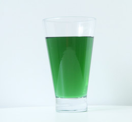 Glass of green liquid on white background, São Paulo, Brazil