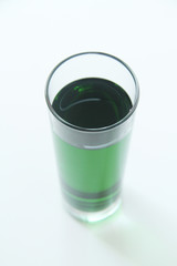 Glass of green liquid on white background, São Paulo, Brazil