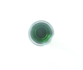 Glass of green liquid on white background, São Paulo, Brazil