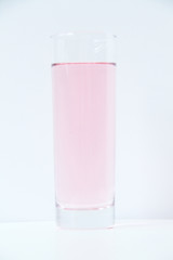 Glass of rose liquid on white background, São Paulo, Brazil