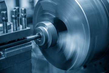 The lathe machine bore cutting the metal ring part shape. The metal working processing by turning...