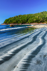Gorgeous black sand beach on sunny summer.