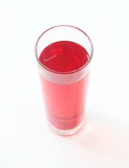 Glass of red liquid on white background, São Paulo, Brazil