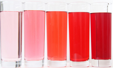 Three glasses of red liquid on white background, São Paulo, Brazil