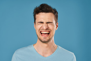 portrait of young man with surprised expression on face
