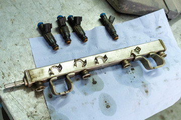 injector cleaning process repair service car auto engine close up selective focus