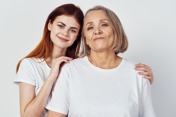 portrait of mother and daughter isolated on white