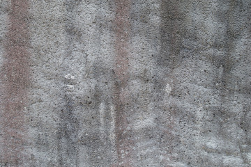 Closeup fragment of grunge weathered wall of a building. Cement floor