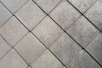 Gray background of rhombuses. Natural background of roof cover. The effect of metal. fastening with nails