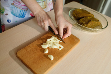 Female cook cooks delicious pastrami