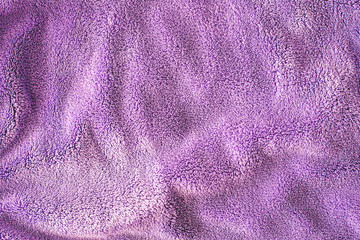 Plakat Lilac delicate soft background of fur plush smooth fabric. Texture of purple soft fleecy blanket textile