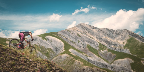 Mountain biker descending in the Alps  © Ian