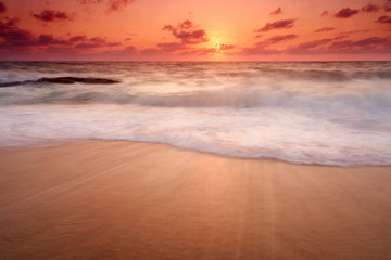 Fototapeta na wymiar Beautiful natural seascape wave move on the sand during sunset
