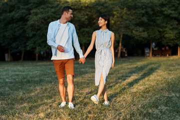 young couple running in the park