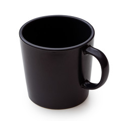 Empty black ceramic mug isolated on white.