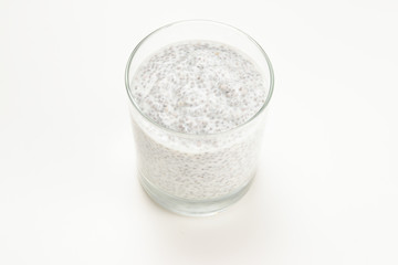 Chia pudding  in glass on a white background. Space for text or design.