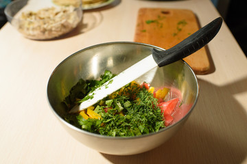 Girl cook makes cutting vegetables for tasty and juicy tortilla