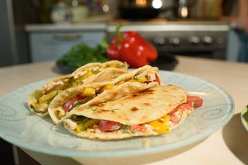 Tasty and juicy tortilla on a glass plate close up