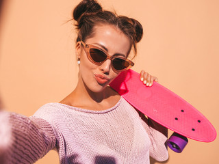 Young beautiful sexy smiling hipster woman in sunglasses.Trendy girl in summer knitted...