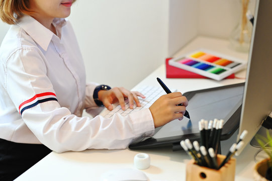 Graphic designer woman working with digital tablet and pen.