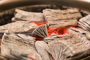 Charcoal in flames for roast meat.