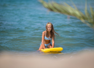Cute little girl swimming and having fun. Summer portrait