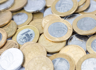 Many scattered brazilian real coins money. Coins of savings. Brazil. Growing business and future concept, coins stack.