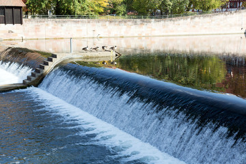 River weir, water in river.