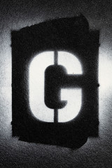 Letter G grunge spray paninted stencil font