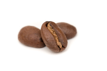 Obraz premium Three Coffee beans roasted arabica isolated on white background
