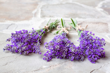 Bouquets of lavender on a concrete background. Medicinal plants. Aromatherapy.