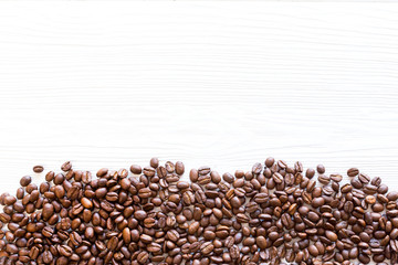 Mixture of different kinds of coffee beans. Coffee Background. roasted coffee beans. coffee beans on structural white wooden background