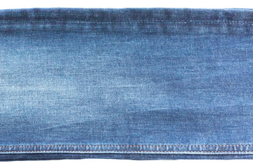 Denim and jeans background, part of jeans with seams, long, isolated