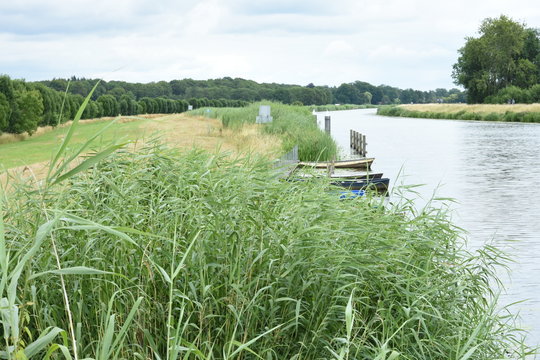 rowing boats at a quay in river Oude IJssel in the Achterhoek
