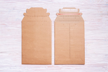 Brown cardboard envelopes, mock up, on wooden desk