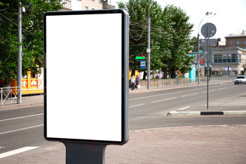 Vertical blank billboard. Mockup of outdoor advertising with copy space on the city street sidewalk