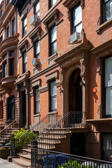 Street scene and apartment buildings of Brooklyn Heights in summer sunny daylight