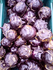 Fototapeta na wymiar Round eggplants in a box