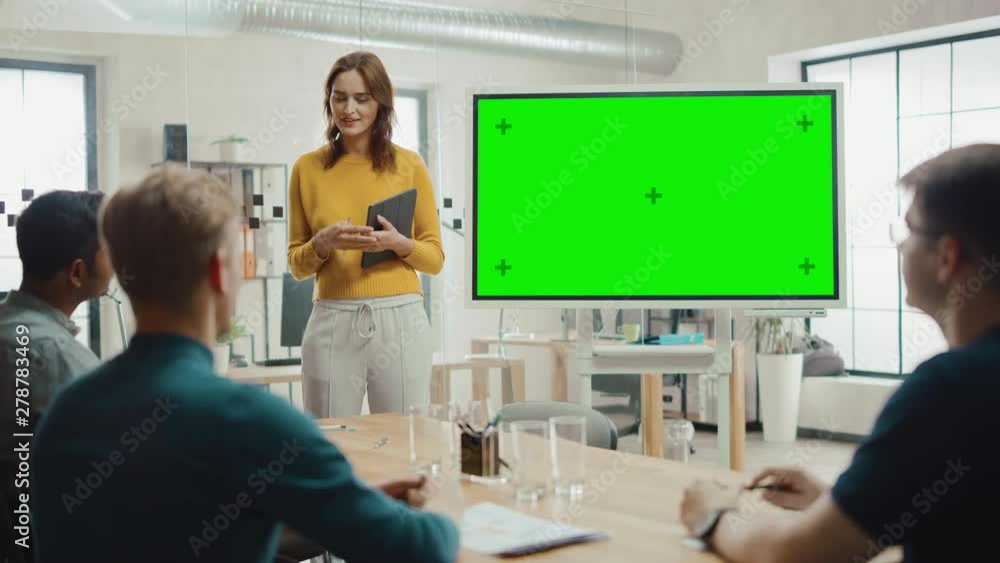 Poster female project manager holds meeting presentation for a team of developers. she shows green screen i