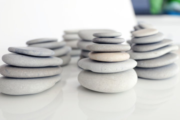 Fototapeta na wymiar Round Gray Stones isolated on a White Background