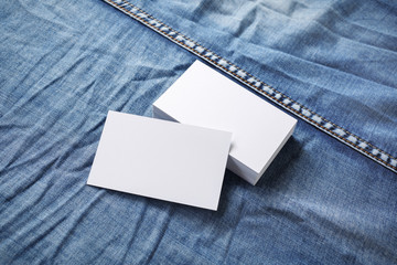 Blank business cards template on denim background. For graphic designers portfolios.