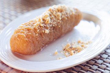 Turkish dessert from Erzurum dolma kadayifi on white plate close up