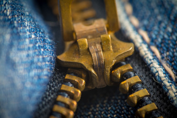 Closeup on blue jeans zipper and button