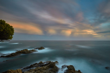 Obraz premium Beautiful sunset light in Costa Brava of Spain, near town Palamos, long exposure picture